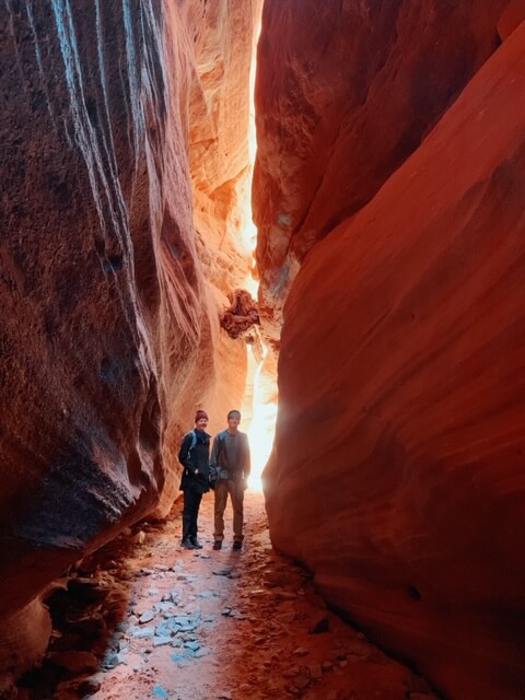 Hikers in a slot canyon