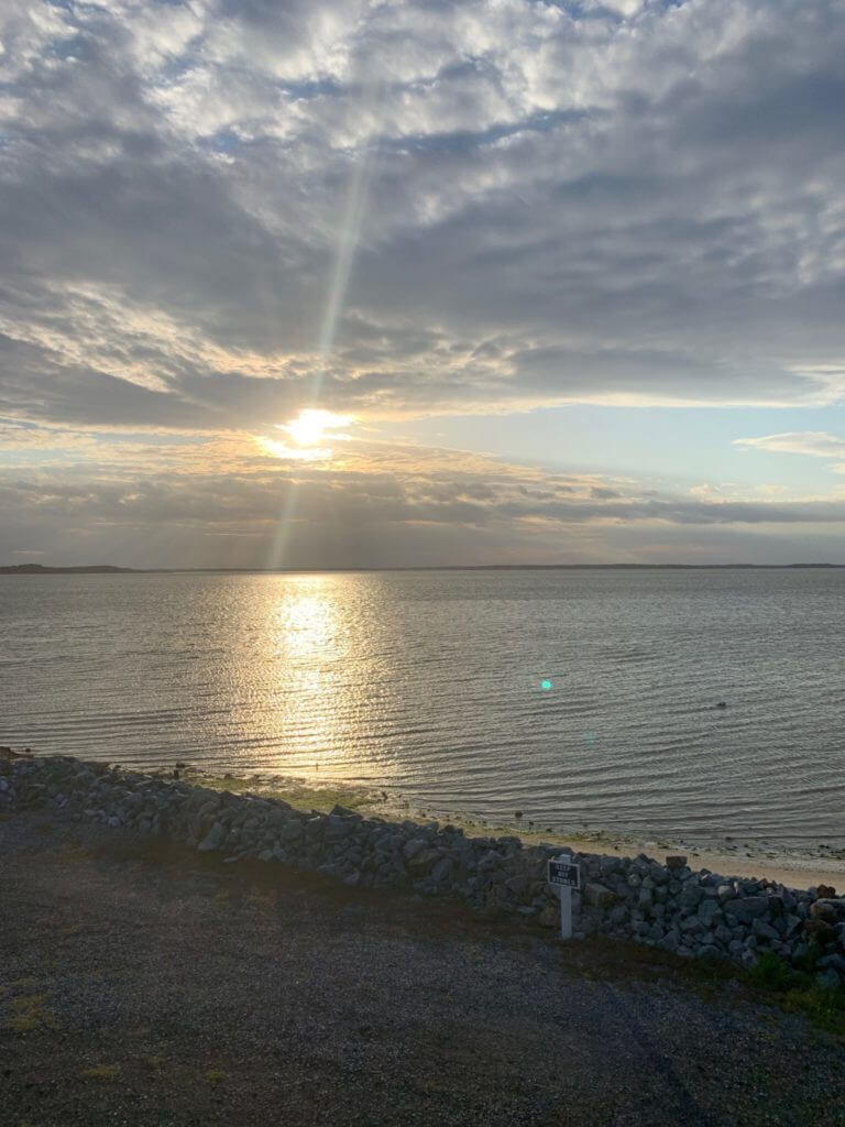 Sun rays shining through clouds at Ocean View, DE