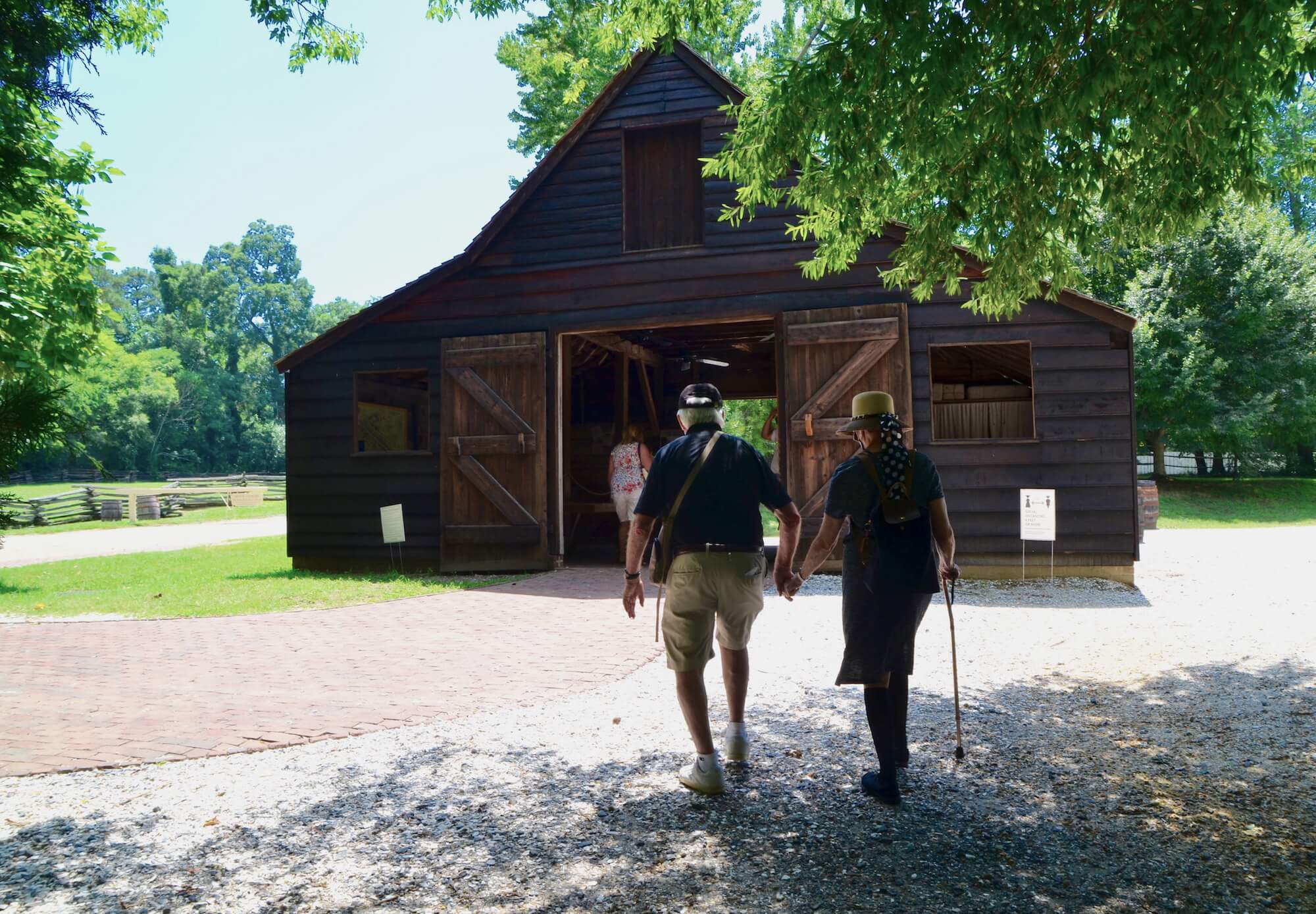 Older Couple Strolling the grounds of Colonial Williamsburg I MemorableWomensTravel.com 
