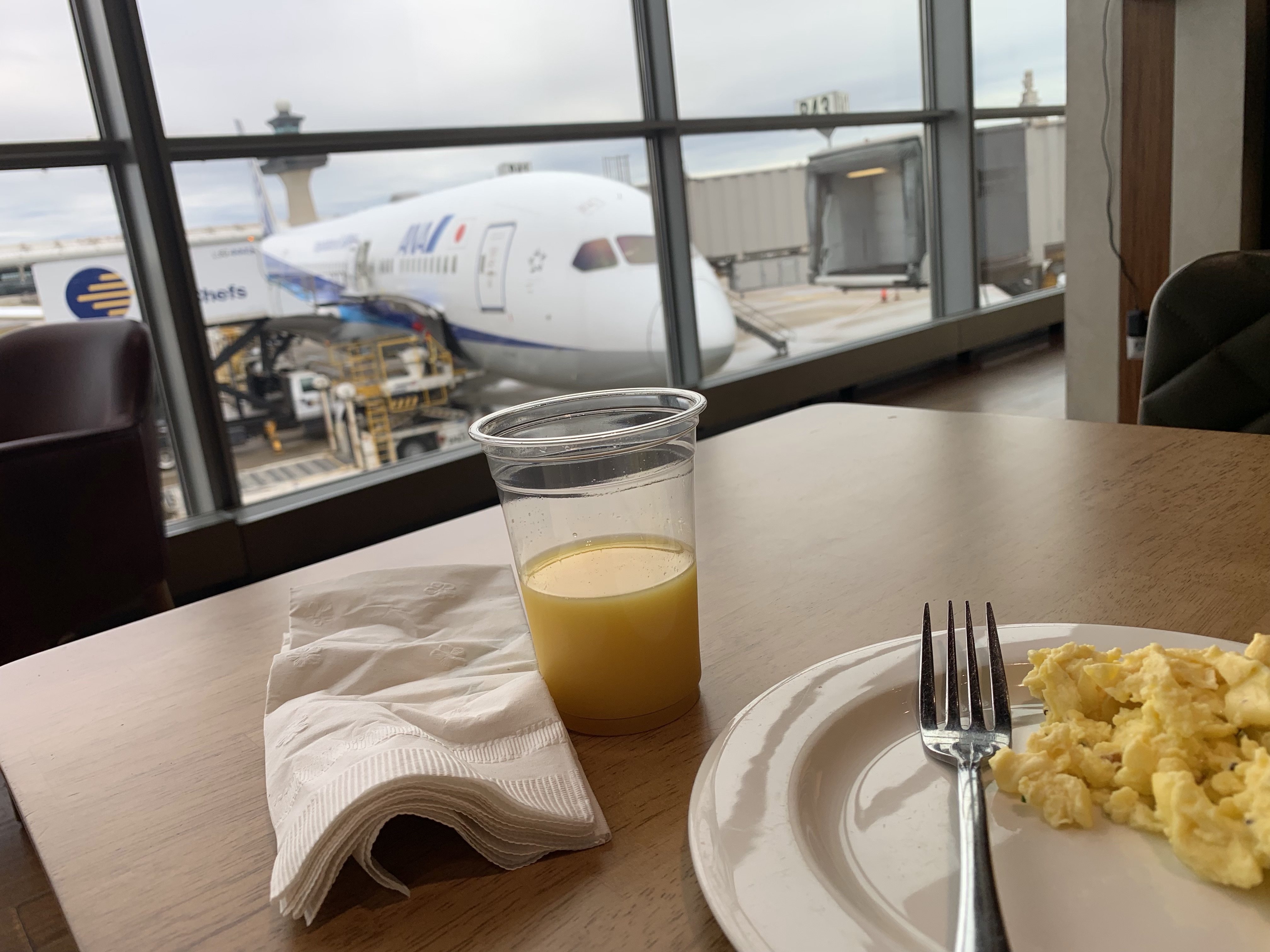 Airport Lounge breakfast with a view I MemorableWomensTravel.com
