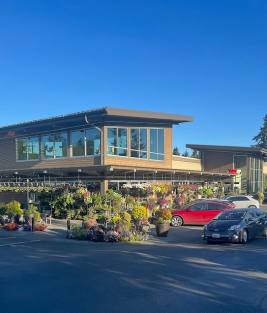 Town and Country Grocery store with flowers out front<br />
