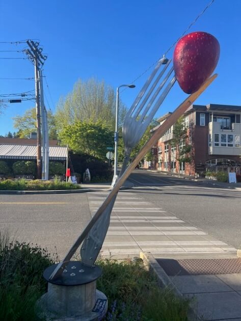 Sculpture of a large fork holding a strawberry on Bainbridge Island WA<br />
